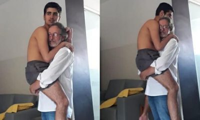 Foto de avô segurando neto autista de 17 anos no colo viraliza na internet