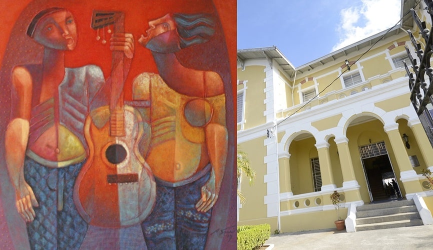 Obra de arte reproduzindo dois homens em cores quentes, à direita; fachada amarela da Pinacoteca de Jundiaí, à esquerda