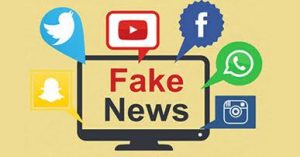 ilustração com desenho de tela de computador e a mensagem: "Fake News", rodeada por ícones das redes sociais