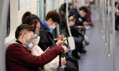 Foto de chineses em trem