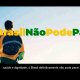 Homem com bandeira do Brasil nas costas e escritos: #OBrasilNãoPodeParar