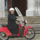 Friar Don Giuseppe Berardelli pilotando moto