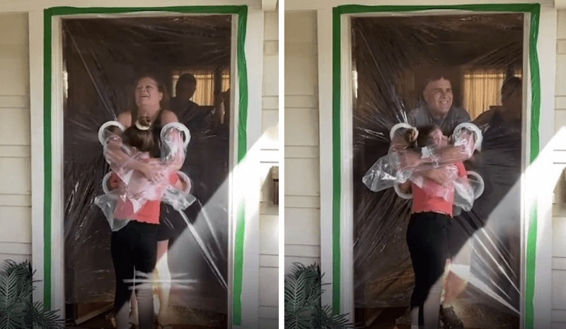 Menina de 10 anos abraça os avós através de cortina de plástico