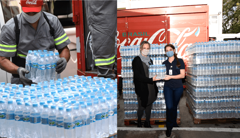 Funcionários da Coca-Cola descarregam caminhão com garrafas de água no Hospital São Vicente
