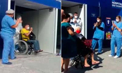 Homem e mulher saindo de cadeira de rodas do Hospital de Campanha