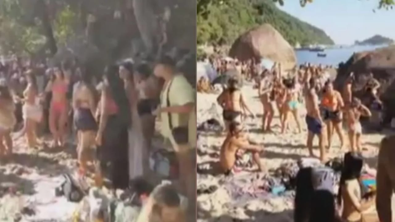 Banhistas lotam praia deserta em Guarujá, litoral de SP