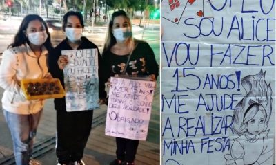 Três mulheres segurando cartazes para venda de brigadeiro