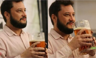 Homem com copo de cerveja